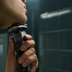 Aparat de ras electric Philips Shaver Series 5000 S5887/10, 9 W, 60 min, pentru ras umed/uscat, trimmer încorporat, SkinIQ, PowerAdapt, capete rotative la 360°, lame cu autoascuțire, gri carbon