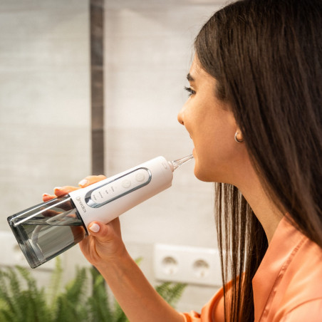 Irigator dentar Nordics Expert EA139W, 300 ml, 5 moduri, 5 jeturi de aer, IPX7, Duza rotativa la 360°, USB-C, Alb