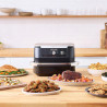 La mâna a doua: Friteuza dubla cu aer cald Ninja AF500EU, 10.4 L, 7 programe, Timer, Zone independente, Negru/Inox